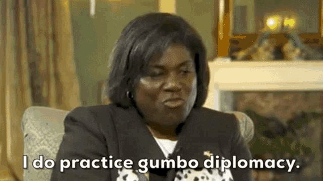 a woman is sitting in a chair and says `` i do practice gumbo diplomacy . ''