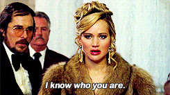 a woman wearing a fur coat says " i know who you are "