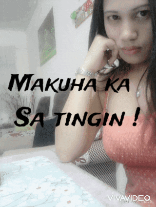 a woman sitting at a table with the words makuha ka sa tingin written on her chest