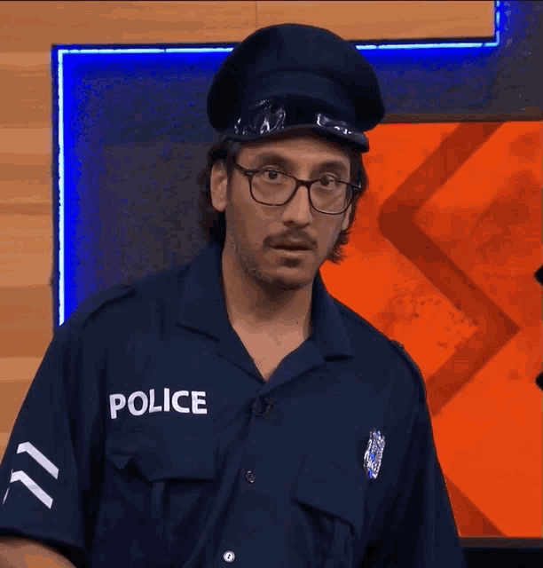 a man in a police uniform with the word police on his chest