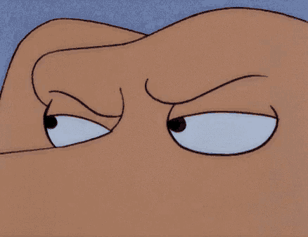a close up of a cartoon character 's face with a serious expression on his face .