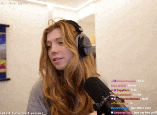 a woman wearing headphones stands in front of a microphone and says " hot float 12/1/09 "