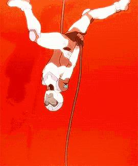 a cartoon character is hanging from a rope against a red background .