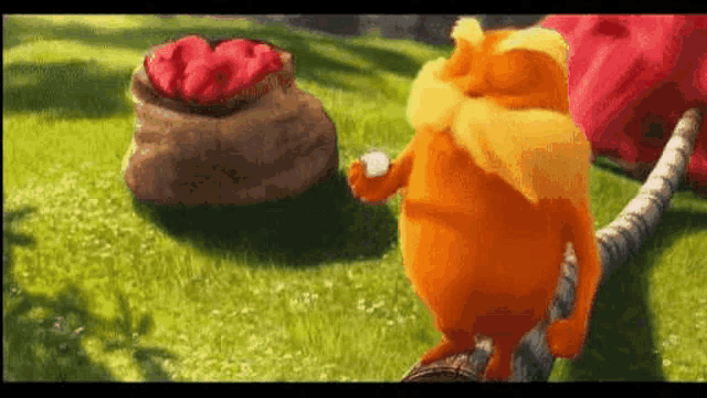 a cartoon character is standing on top of a lush green field with a bag of flowers in the background .