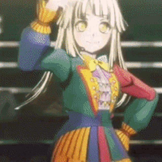 a girl in a colorful dress is standing on a stage .