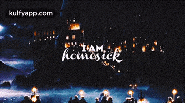 a group of people are gathered in front of a building with the words " i am homesick " on it