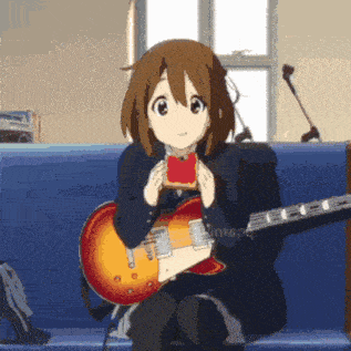 a girl is sitting on a couch holding a guitar and eating toast