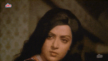 a close up of a woman 's face with the word ultra in the corner