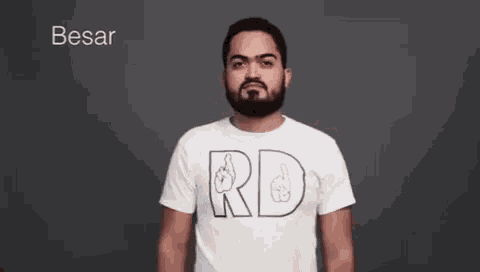 a man with a beard wearing a white t-shirt that says rd on it .