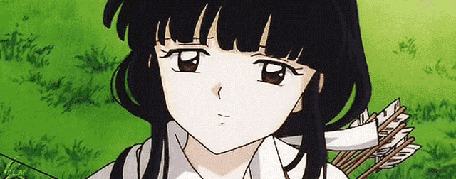 a girl with long black hair is holding a bow and arrow in her hand .