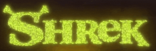 the word shrek is glowing in the dark with a dark background .