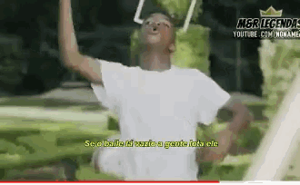a man in a white shirt is dancing in front of a youtube advertisement