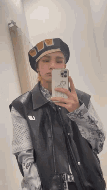 a man taking a picture of himself in a mirror