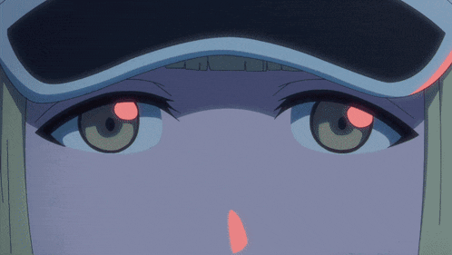 a close up of a girl 's face with a hat on