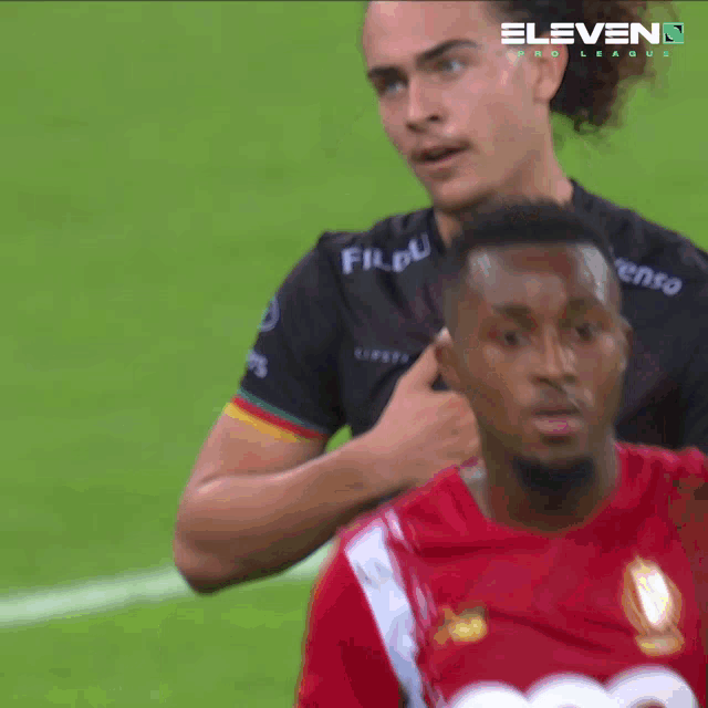 a soccer player wearing a black shirt that says star casino on it
