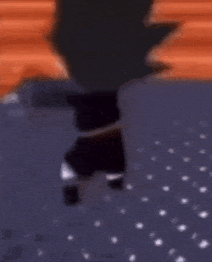 a little boy is standing on a blue rug holding a sword .