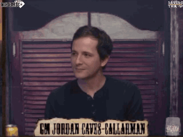 a man says i am fucki in front of a sign that says em jordan caves-callarman