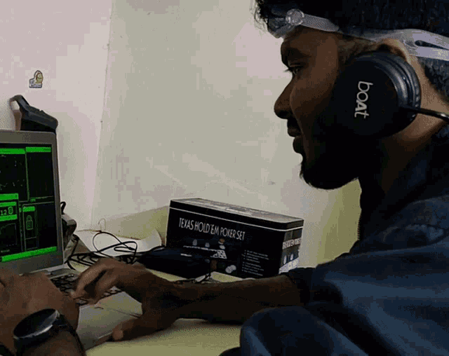 a man wearing headphones that say boat on them