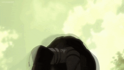 a close up of a person 's head with a green background