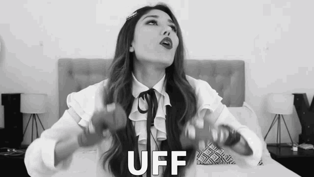 a black and white photo of a woman with the word uff in the corner