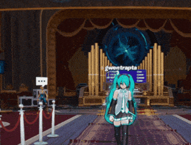 gwentrapta is standing in front of a stage with a large blue object in the background