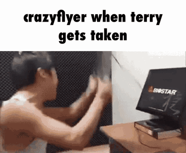 a man sitting in front of a computer with the words crazyflyer when terry gets taken on the bottom