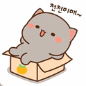 a cartoon cat is sitting in a cardboard box with an orange .