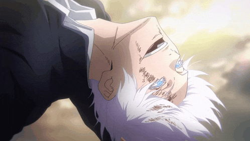 a man with white hair is laying upside down