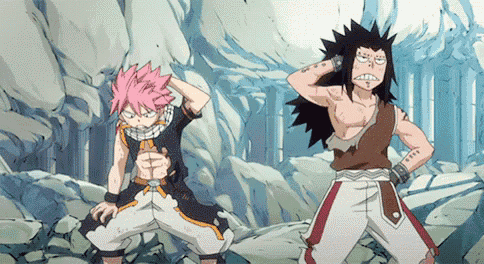 a couple of anime characters are standing next to each other on a rocky hillside .