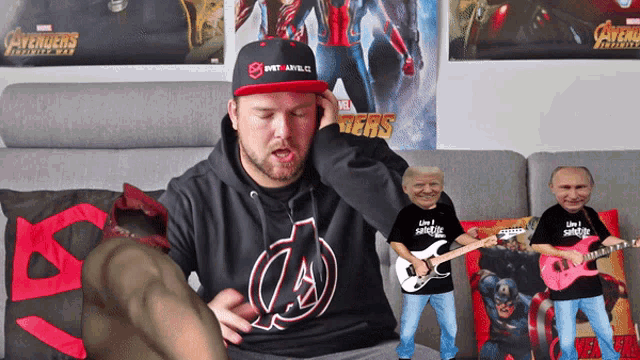 a man wearing a hoodie that says avengers infinity war