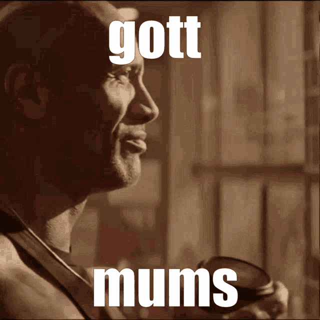 a close up of a man 's face with the words gott mums written on it
