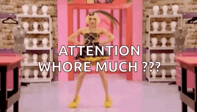 a drag queen is standing in front of a mannequin in a pink room and says `` attention whore much '' .