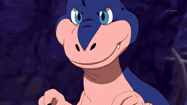 a cartoon of a dinosaur is shown on a tv channel in japan