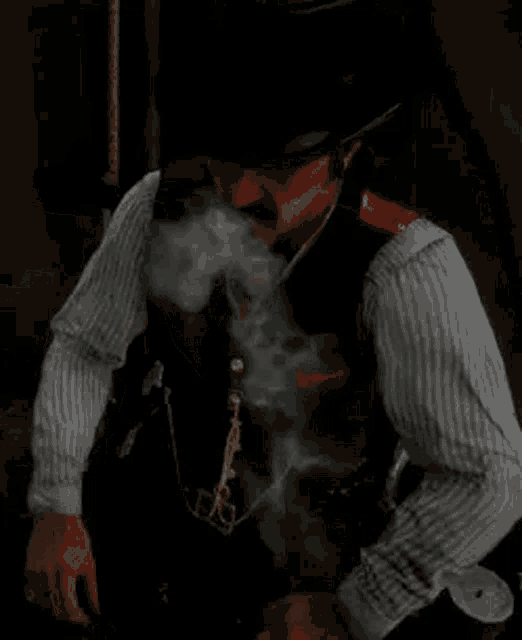 a man in a hat and vest is smoking a cigarette .