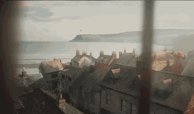 a view of a city with a cliff in the background