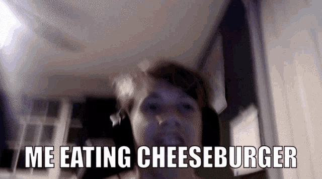 a blurry picture of a woman with the words " me eating cheeseburger "