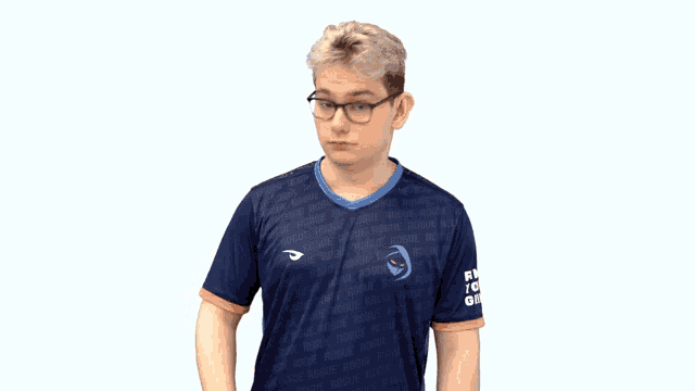 a man wearing glasses and a blue shirt that says rogue