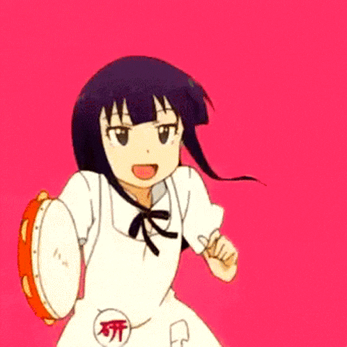 a girl in a white dress is holding a tambourine in her hand .