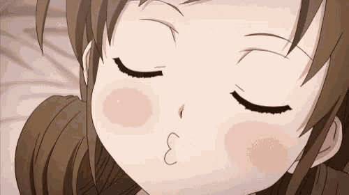 a close up of a girl 's face with the letters e on her cheek