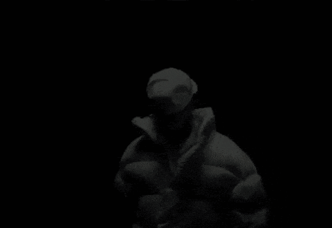 a man in a white jacket and hat is dancing