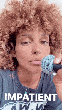 a woman with curly hair is singing into a microphone with the word impatient written below her