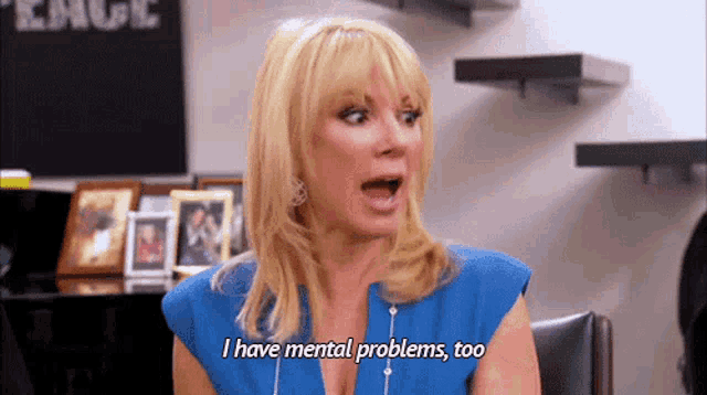 a woman in a blue shirt is talking about her mental problems