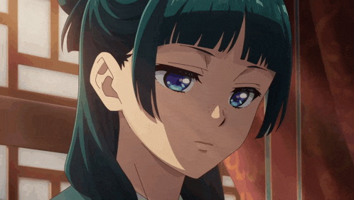 a close up of a girl with blue eyes and green hair