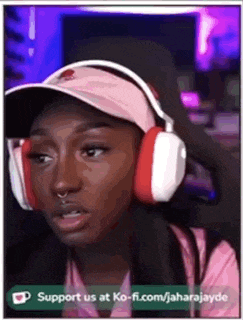 a woman is wearing headphones and a hat .