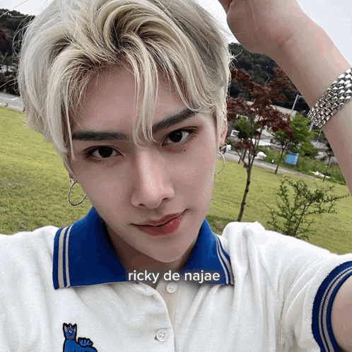 a young man taking a selfie with the caption ricky de najae on the bottom