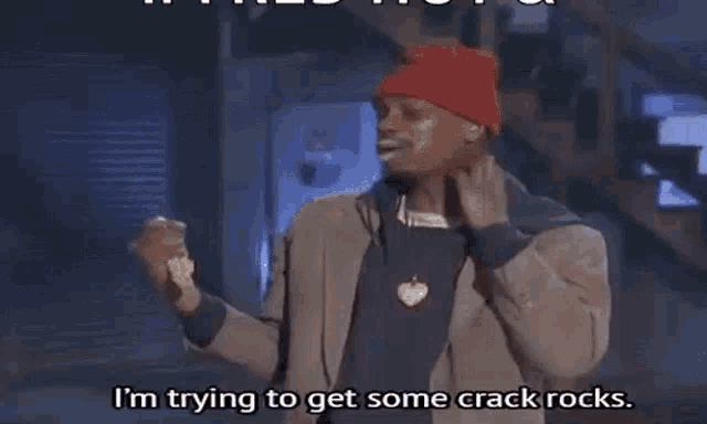 a man wearing a red beanie and a brown jacket is saying i 'm trying to get some crack rocks