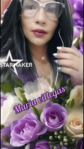 a woman wearing glasses is surrounded by purple flowers and the name maria villegas