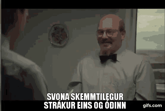 a bald man with glasses and a mustache is talking to another man .