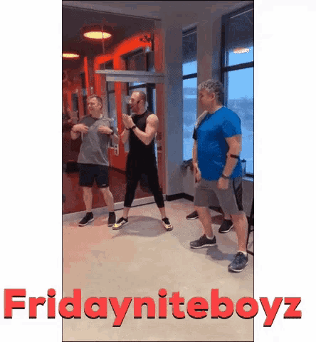 a group of men standing in a gym with the words fridayniteboyz