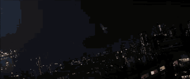 a falcon is flying over a captain america shield in the dark